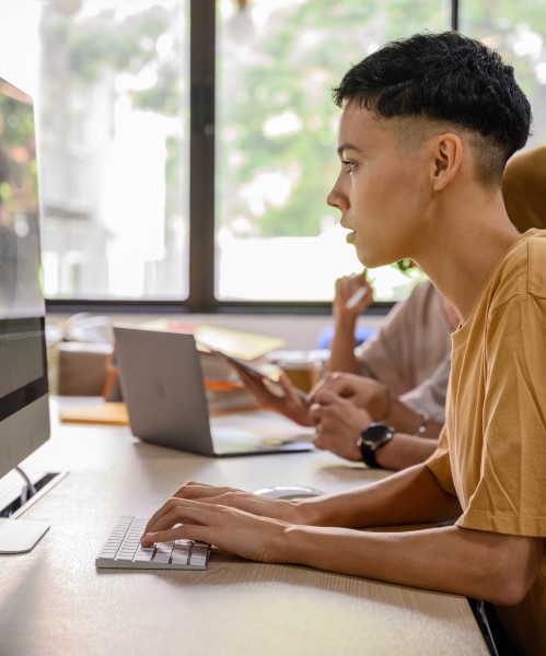 Student studying for the GED Test on a computer